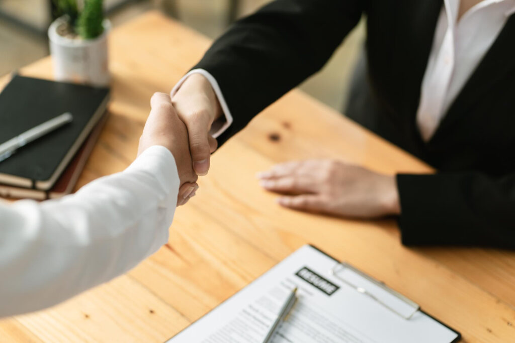 shaking hands after hiring a new employee